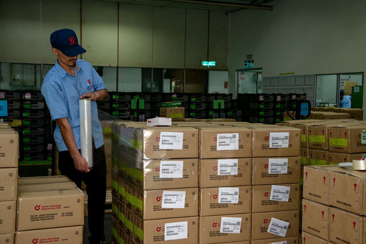 Operator wrapping finished products for shipment